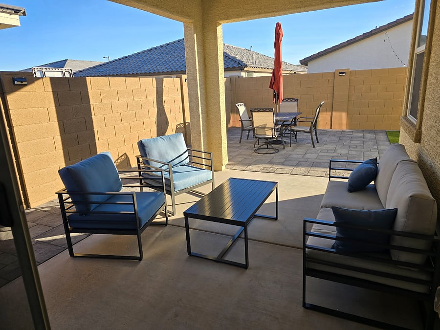 Covered backyard patio at The Greenwood furnished rental